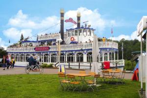 a ride on a boat with people on it at Apartment, Wieck am Darss in Wieck