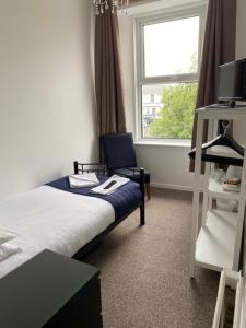 Postel nebo postele na pokoji v ubytování Nethway Hotel
