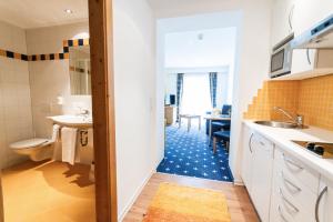 Koupelna v ubytování Aktiv Hotel Zur Rose am Brenner + 37 fotografií