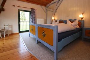 a bedroom with a large bed in a room at Ferienhaus, Zahrensdorf in Zahrensdorf