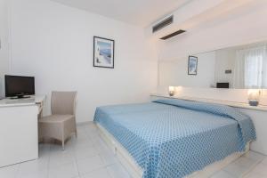 Postel nebo postele na pokoji v ubytování Hotel Valle Verde