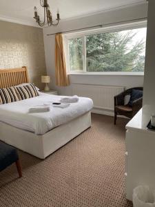 Postel nebo postele na pokoji v ubytování Nethway Hotel