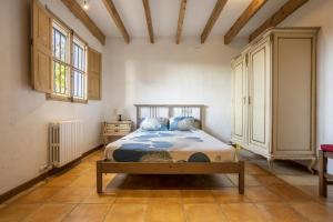 a bedroom with a bed in a room with a window at Villa Coric in Inca +32 photos