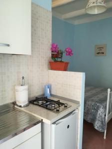a kitchen with a stove and a counter top at A casa mia in Vietri sul Mare