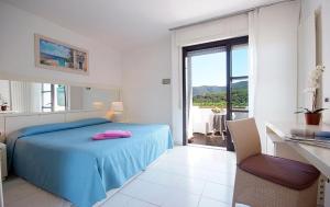 Postel nebo postele na pokoji v ubytování Hotel Valle Verde
