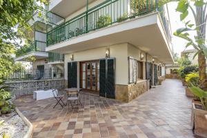 an external view of a house with a patio at House Can Toni in Port d'Alcudia