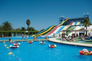 a group of people in boats in a water park at House Can Toni in Port d'Alcudia