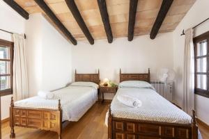 Postel nebo postele na pokoji v ubytování Casa Ibicenca Sagitario