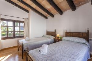 Giường trong phòng chung tại Casa Ibicenca Sagitario 454