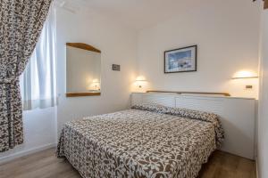 Postel nebo postele na pokoji v ubytování Hotel Valle Verde