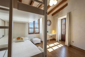 Postel nebo postele na pokoji v ubytování House Can Piu