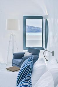 Uma cama ou camas num quarto em Maregio Suites