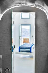 Uma cama ou camas num quarto em Maregio Suites