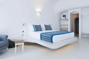 Uma cama ou camas num quarto em Maregio Suites