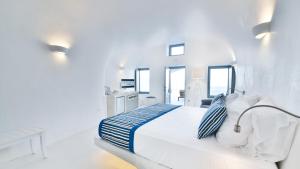 Uma cama ou camas num quarto em Maregio Suites