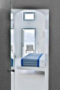 Uma cama ou camas num quarto em Maregio Suites