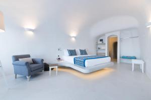 Uma cama ou camas num quarto em Maregio Suites
