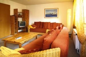 a living room with a couch and a table at Apartment, Schwerin in Schwerin