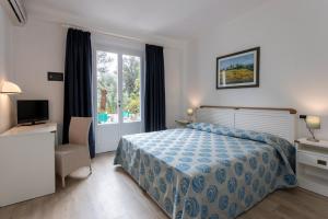 Postel nebo postele na pokoji v ubytování Hotel Valle Verde