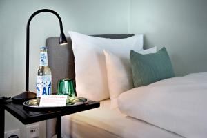 Giường trong phòng chung tại Hotel Rotkreuzplatz +17 ảnh