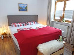 Кровать или кровати в номере Ferienwohnanlage Grenzhub Murmeltier