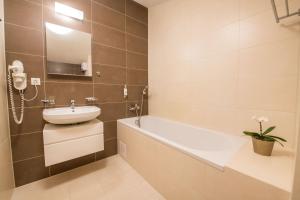 Kúpeľňa v ubytovaní Hotel Slovan