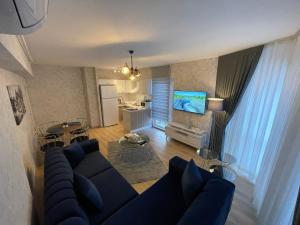 an overhead view of a living room with a blue couch at King Suite SS0 in Istanbul
