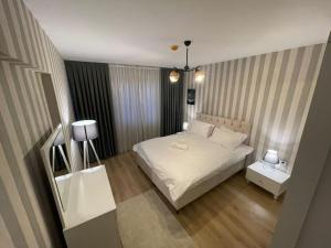 Ένα ή περισσότερα κρεβάτια σε δωμάτιο στο King Suite SS0