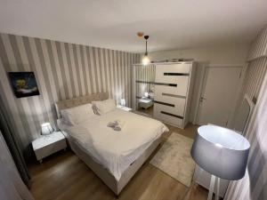 a small bedroom with a bed and a sink at King Suite SS0 in Istanbul