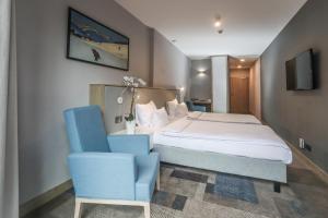 Postel nebo postele na pokoji v ubytování Magnus Resort