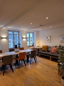 a living room with a table and chairs and a couch at Schlössje in Lieser
