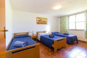 A bed or beds in a room at Appartamenti in Villa con ampio giardino esterno