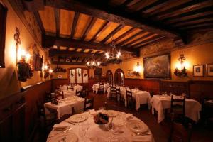 En restaurang eller annat matställe på Hotel Arnaldo Aquila D’oro