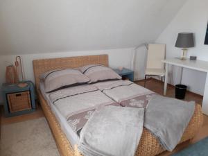 a bedroom with a bed with pillows on it at Kandelblick in Teningen