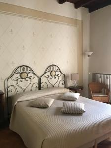 Rúm í herbergi á B&B Artincentro