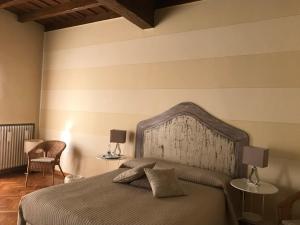 Rúm í herbergi á B&B Artincentro