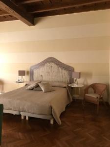 Rúm í herbergi á B&B Artincentro