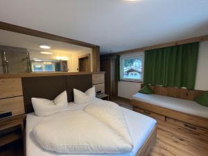 Postel nebo postele na pokoji v ubytování Appartement Pension Strolz