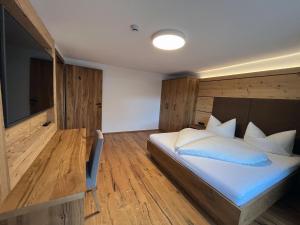Postel nebo postele na pokoji v ubytování Appartement Pension Strolz