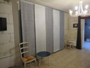 TV a/nebo společenská místnost v ubytování Le Gîte des Marguerites