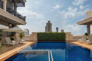 a swimming pool on the roof of a building at Duong Chan Hotel in Phnom Penh