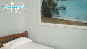 Postel nebo postele na pokoji v ubytování Akrogiali Hotel Restaurant
