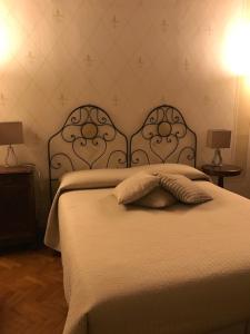 Rúm í herbergi á B&B Artincentro