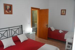 Ein Bett oder Betten in einem Zimmer der Unterkunft Hostal El Levante