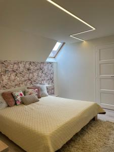 Posteľ alebo postele v izbe v ubytovaní Zen Apartman