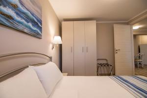 Ένα ή περισσότερα κρεβάτια σε δωμάτιο στο Amaranti Luxury Apartments +29 φωτογραφίες