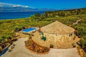 an aerial view of a house with a swimming pool at House Villa Getaway in Mirce