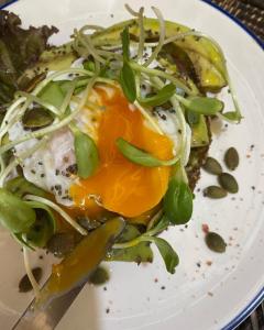 a plate of food with an egg and vegetables at Sonya Kohlanta in Ko Lanta