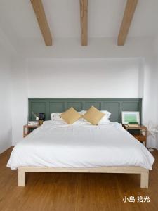 Voodi või voodid majutusasutuse 小島拾光 宜蘭田間包棟民宿Taiwan Yilan Private Villa Paddy view with tranquil & chill vibes toas