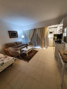 a living room with a couch and a table at Apartment PYR in Fuengirola